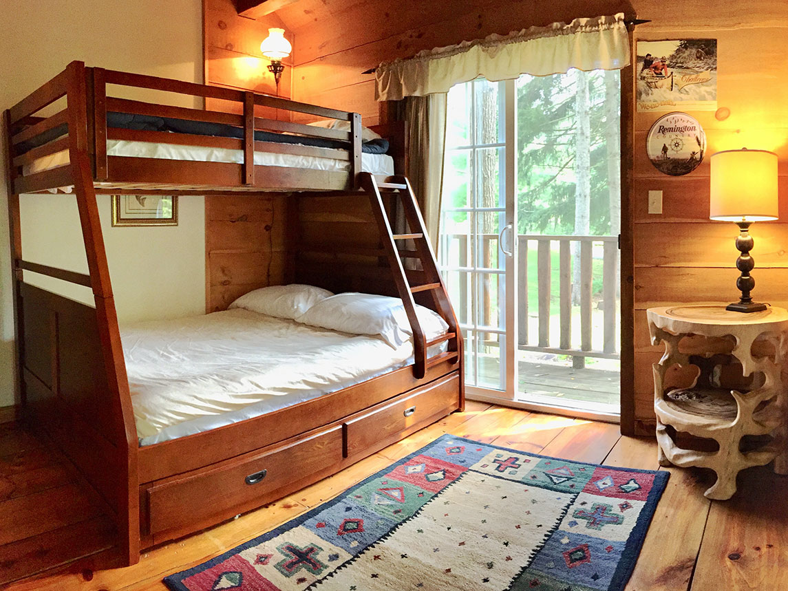 The bunkbed in the third bedroom has a full-size bed on the bottom and a twin on top.