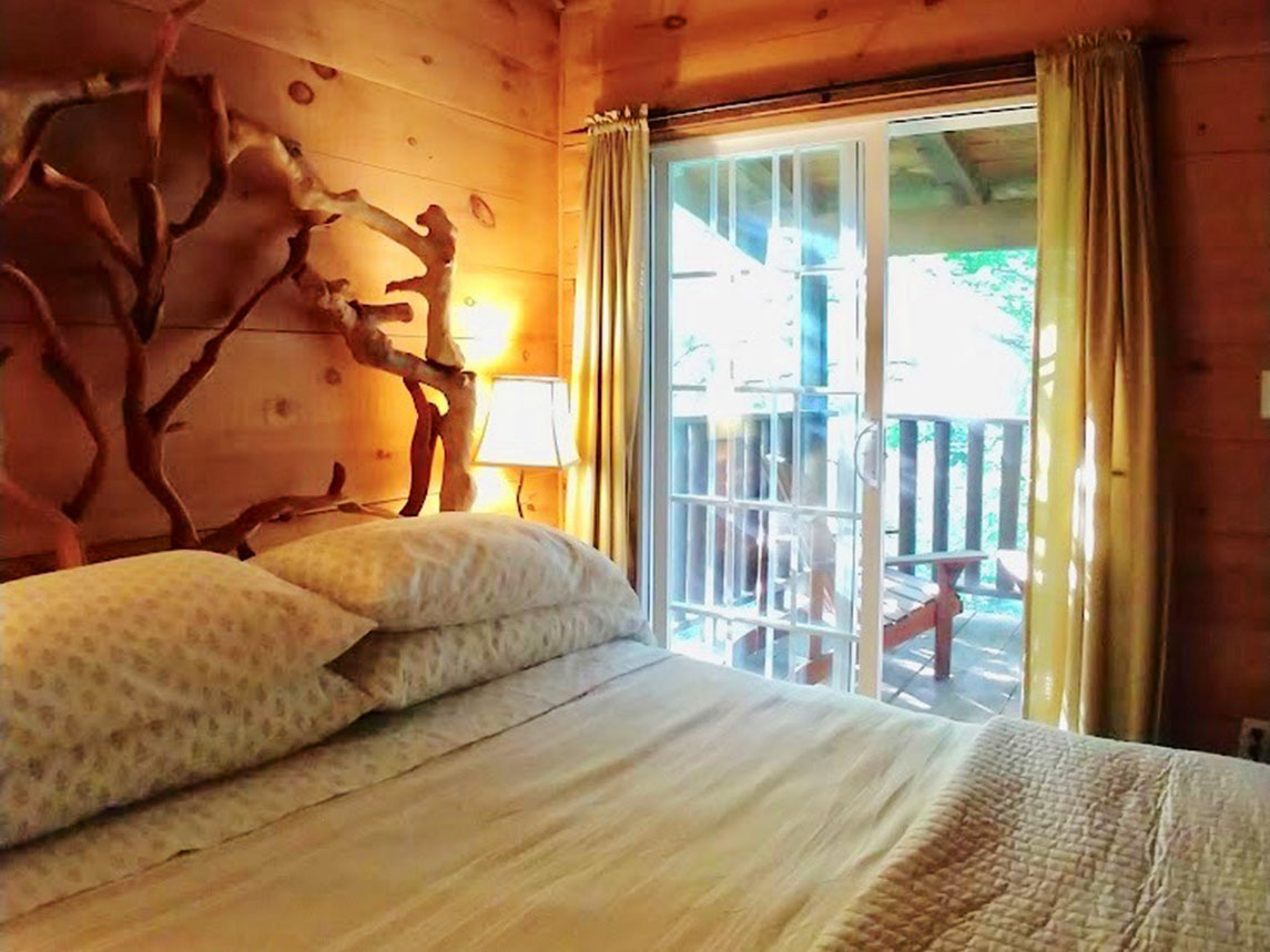 One of three lovely, comfortable bedrooms at Fern Cabin, all with private access to the outdoors.